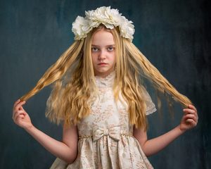 Young girl with long blonde hair and flower crown, Pudsey Camera Club.
