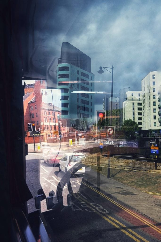 Cityscape reflection with modern buildings and cloudy sky at Pudsey Camera Club.