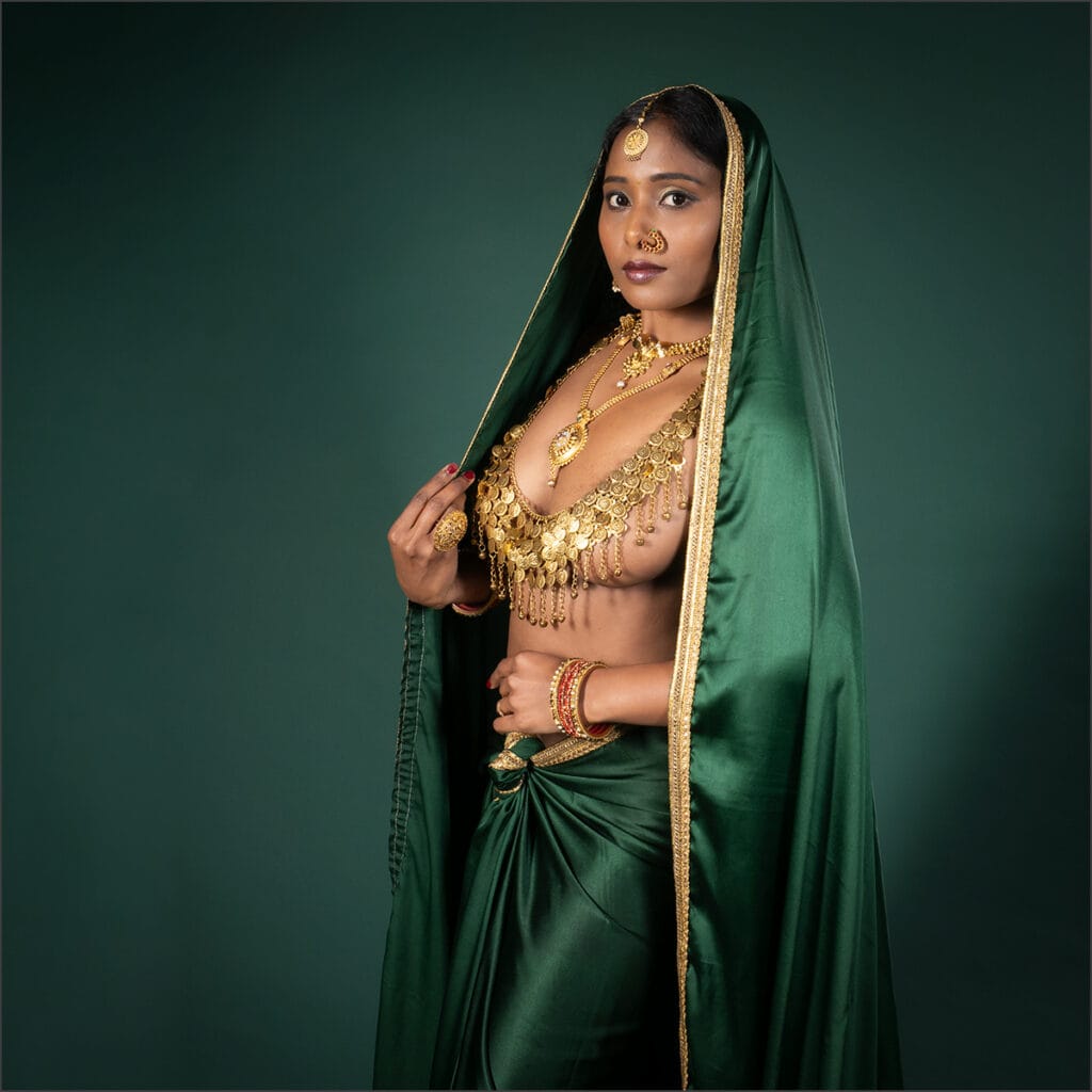 Beautiful woman in traditional Indian dress with gold jewelry at Pudsey Camera Club.