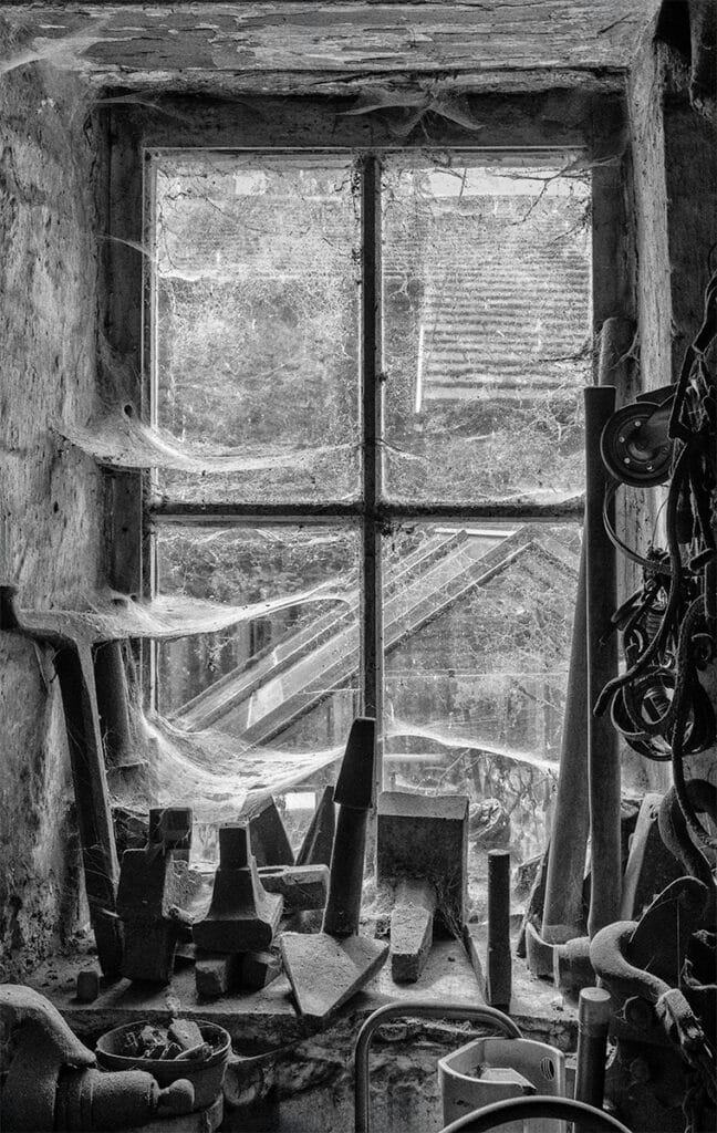 Old workshop scene with tools and a window, Pudsey Camera Club.